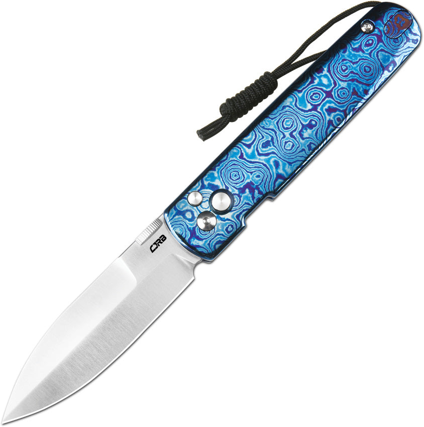 J1951GMTDB1: CJRB Perfect Locust button lock, Damascus titanium handle, 3.13" polished MagnaCut spear point blade